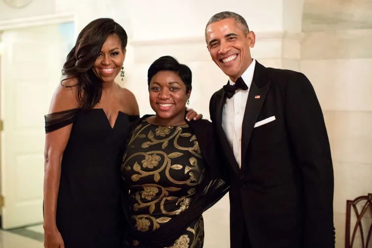 President Barack Obama and First Lady Michelle Obama pose with Social Secretary Deesha Dyer following a State Dinner at the White House, Sept. 25, 2015.