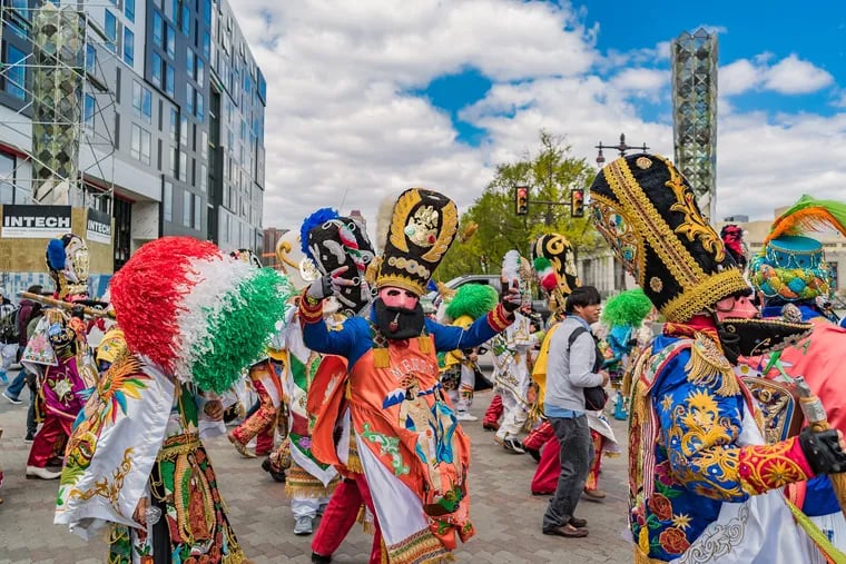 A group of Carnavaleros march on Broad Street during the 2019 Carnaval de Puebla.