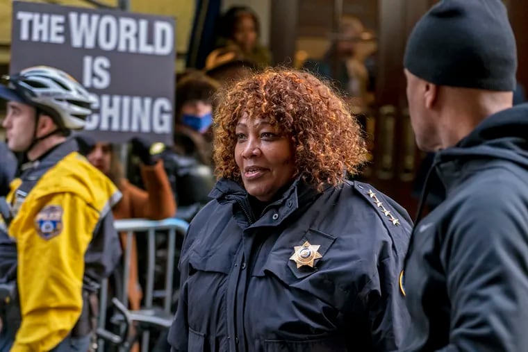 In this file photo, Philadelphia Sheriff Rochelle Bilal stands in January as protesters gather outside the Union League of Philadelphia. A report released Wednesday by the Office of the City Controller found that Bilal's office could not account for nearly 200 guns.