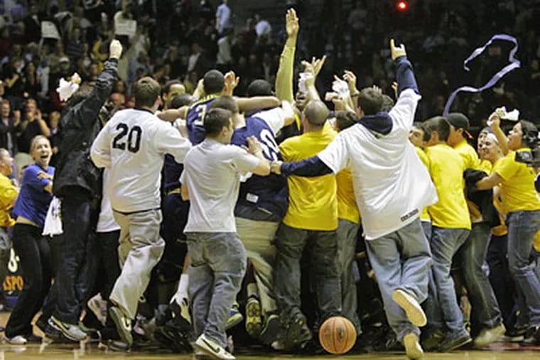 LaSalle Fans swarm the crowd after their upset of St. Joe's at the Palestra on Feb. 18, 2008.   (Ron Cortes / Staff Photographer)