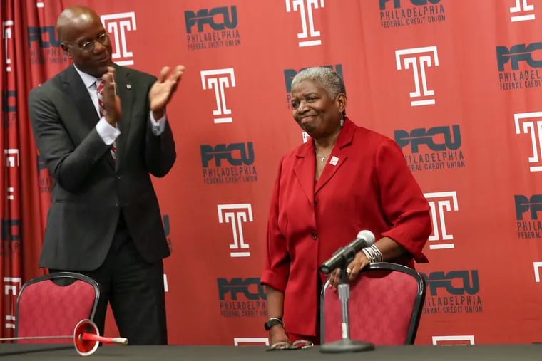 Longtime Temple fencing coach Nikki Franke, right, receives a standing ovation before the start of a press conference announcing her retirement after a 50 year career at the Liacouras Center in Philadelphia on Tuesday. Franke is the all-time winningest women’s coach and longest-tenured coach in Temple school history. Applauding her in this photo is Temple president Jason Wingard.
