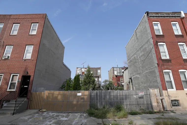 An overall view of two lots at 1834 and 1836 N 4th Street in Philadelphia, PA on September 23, 2019. These are properties that were acquired from estates of the dead. Unregulated and unlicensed entrepreneurs are scouring poor neighborhoods for heirs, paying them low-ball prices for their real estate and flipping it for gigantic profits.