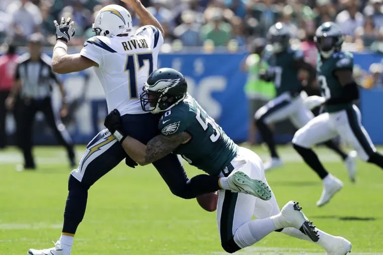 Eagles defensive end Chris Long forces a first-quarter fumble against Chargers quarterback Philip Rivers on Sunday.