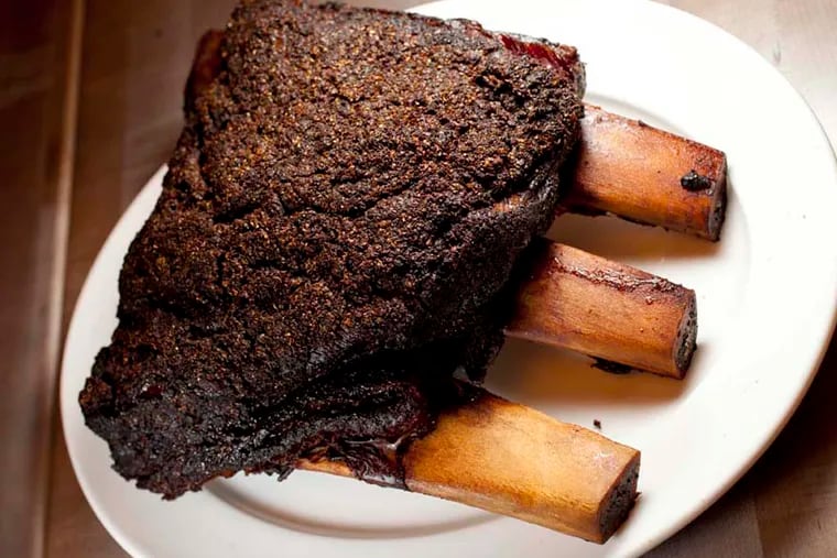 Montreal smoked short ribs for 4 before being carved at Abe Fisher, 1623 Sansom St, Philadelphia.  ( DAVID M WARREN / Staff Photographer