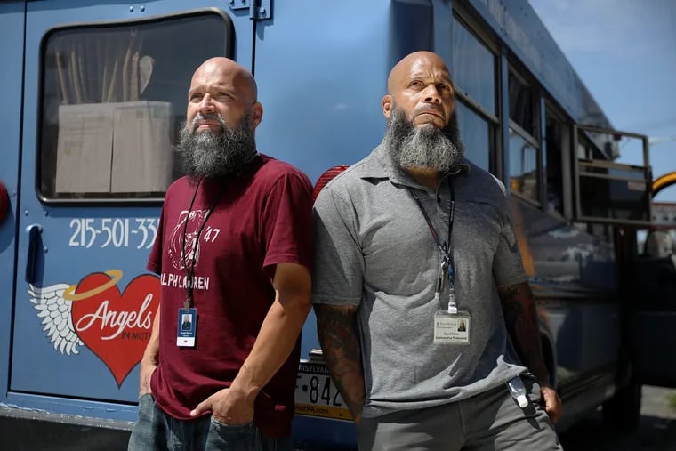 Brothers Angel (left) and Bryant Rivera stand for a portrait at the Angels in Motion mobile syringe exchange bus in Philadelphia's Frankford section on Friday, June 26, 2020. Their family has struggled with addition, and the brothers are now outreach workers: Angel works out of the bus, while Bryant works at Penn Medicine.