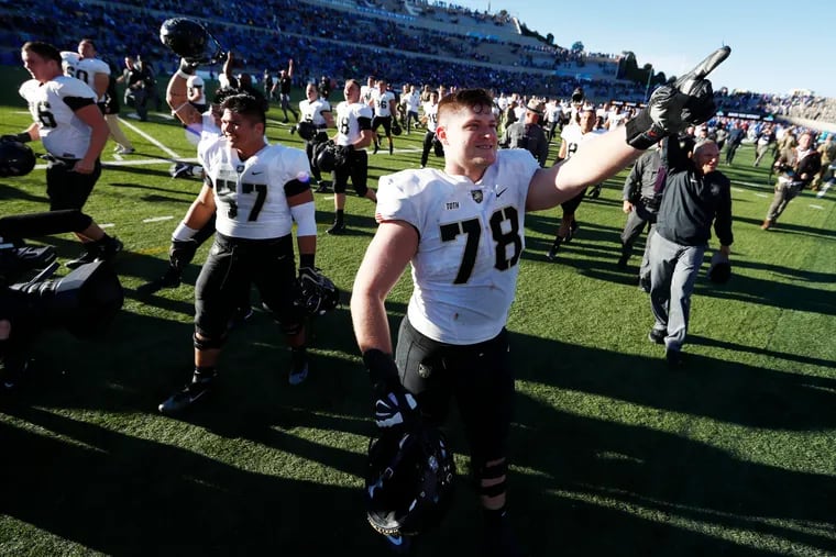 Army offensive lineman Brett Toth gestures to fans as time runs out in the second half of an NCAA college football game against Air Force, Saturday, Nov. 4, 2017, at Air Force Academy, Colo. (AP Photo/David Zalubowski)