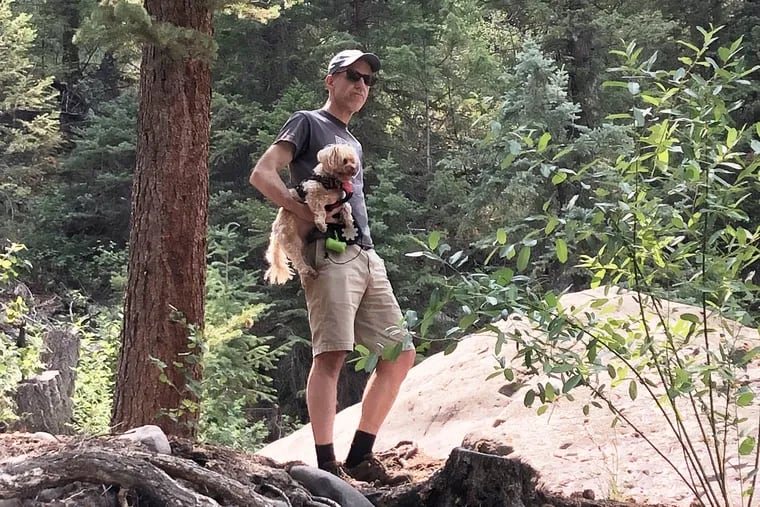 Inquirer reporter Tom Avril and his dog, Penny, got used to the altitude at a family reunion in Colorado, but an apparent case of COVID-19 wore him out.