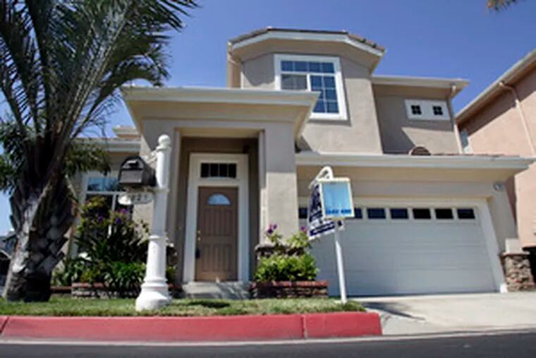 This house in Huntington Beach, Calif., is listed as in foreclosure on a state Web site. Analysts say a rise in mortgage defaults is driving the housing slump.