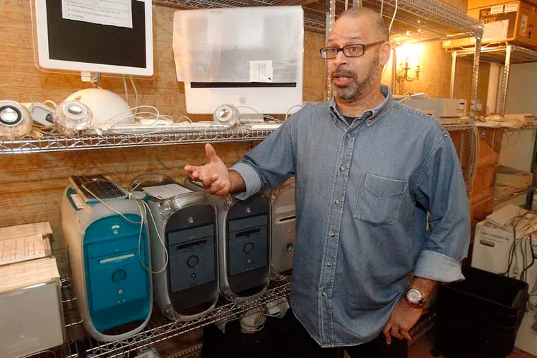 Michael Metelits, 53, among the computers his mother had set up at her home in Rittenhouse Square to continue her news archiving beyond the era of videotape.