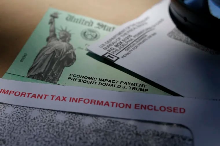FILE - In this April 23, 2020, file photo, a stimulus check issued by the IRS to help combat the adverse economic effects of the COVID-19 outbreak. (AP Photo/Eric Gay, File)