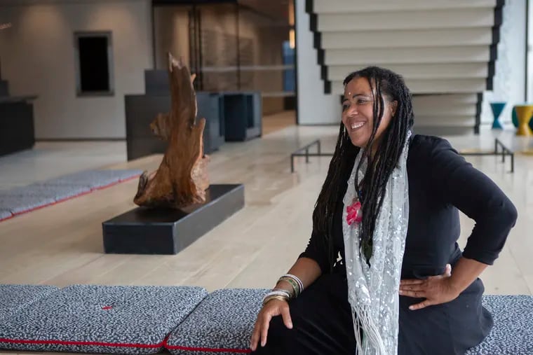 Artist Pauline Houston-McCall with one of her a sculptures at Wells Fargo's corporate offices in Manhattan's Hudson Yards. The Philly artist was commissioned to create 19 artworks for the building.