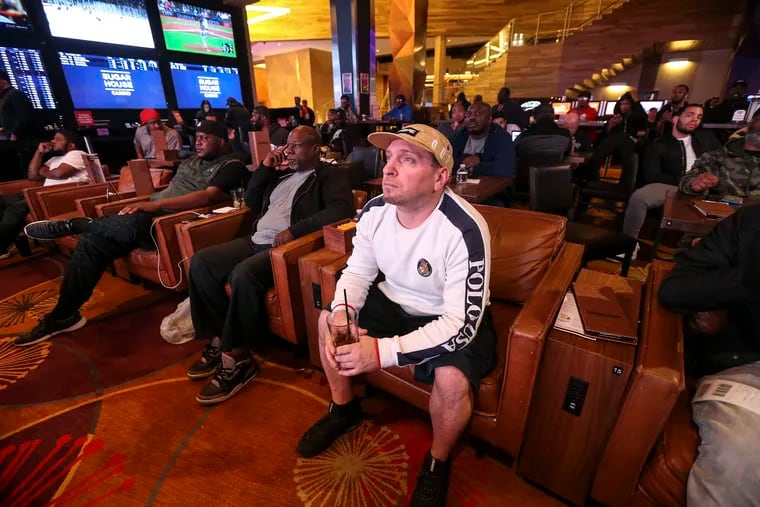Christopher Love from South Philadelphia sports betting watching the Sixers-Raptors game six at Super House Casino. Tuesday was the one-year anniversary of the U.S. Supreme Court's ruling legalizing sports betting.