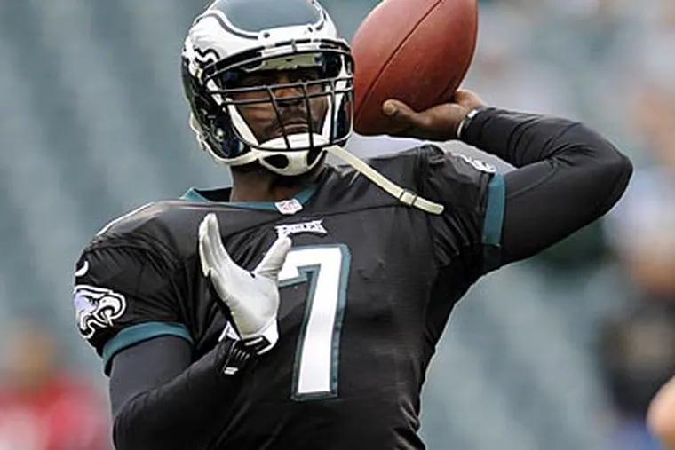 Neither Michael Vick nor Nick Foles have been told that they are reversing jobs, sources say. (Michael Perez/AP)