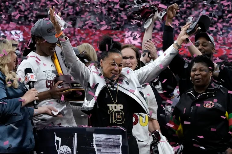 South Carolina head coach Dawn Staley celebrates her team's national title on Sunday. It's the third time she has led the Gamecocks to a championship, but this one looked a little different.