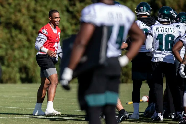 Philadelphia Eagles quarterback Jalen Hurts (1) interacts with teammates during Philadelphia Eagles practice at the NovaCare Complex in South Philadelphia, Pa. on Thursday, October 28, 2021. The Eagles face the Lions in Detroit on Sunday.