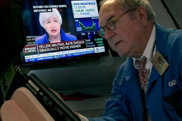 Federal Reserve Chair Janet Yellen’s news conference is shown on a screen on the floor of the New York Stock Exchange. Stocks went up on the news.