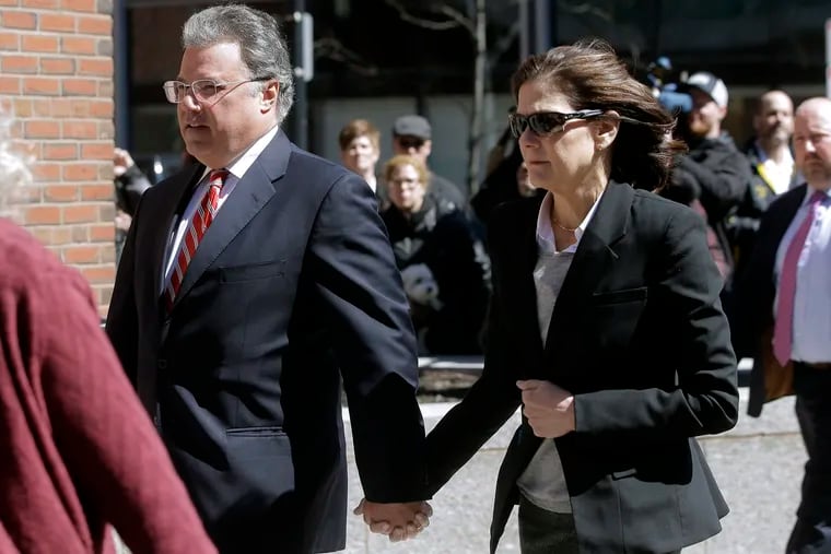 Manuel and Elizabeth Henriquez arrive at federal court in Boston in April 2019 to face charges in a nationwide college admissions bribery scandal.
