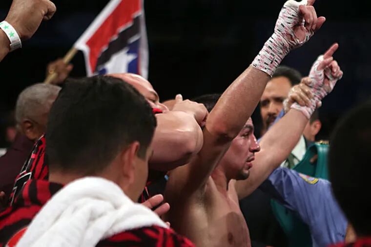Unified Super Lightweight World Champion Danny "Swift" Garcia celebrates. (Ricardo Arduengo/AP)