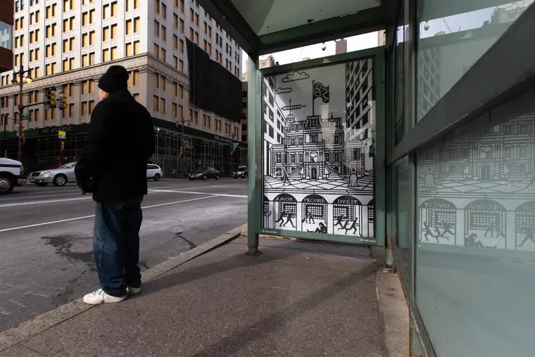 Art work by Joe Boruchow, which criticizes the Union League of Philadelphia and illustrates it flying a Confederate Flag, adorns a bus stop at the intersection of Broad St. and Spruce St. Sunday, February 10, 2019.