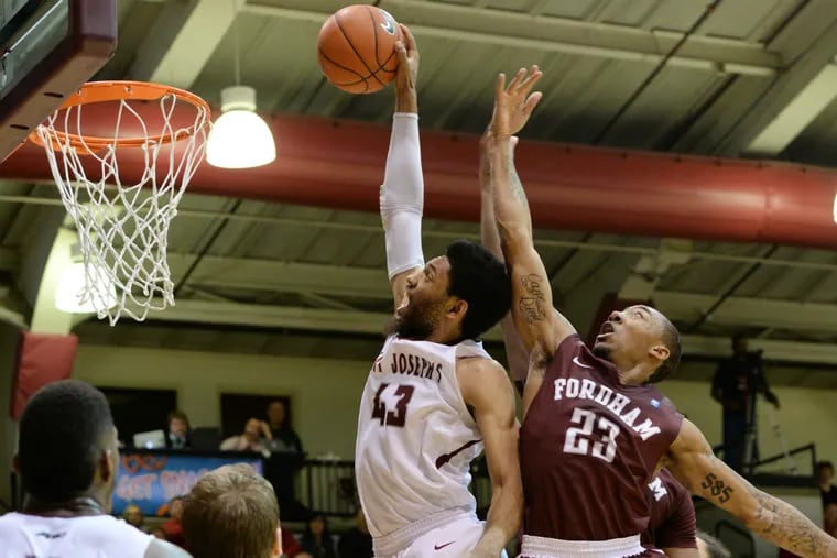 St. Joe's DeAndre' Bembry (43) goes up for a dunk past Fordham's Mandell Thomas (23) during the second half of a recent game.