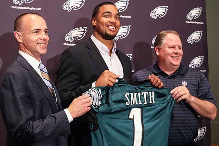 After being drafted 26th overall in 2014, Marcus Smith was flanked by Eagles president Don Smolenski (left) and then-coach Chip Kelly.