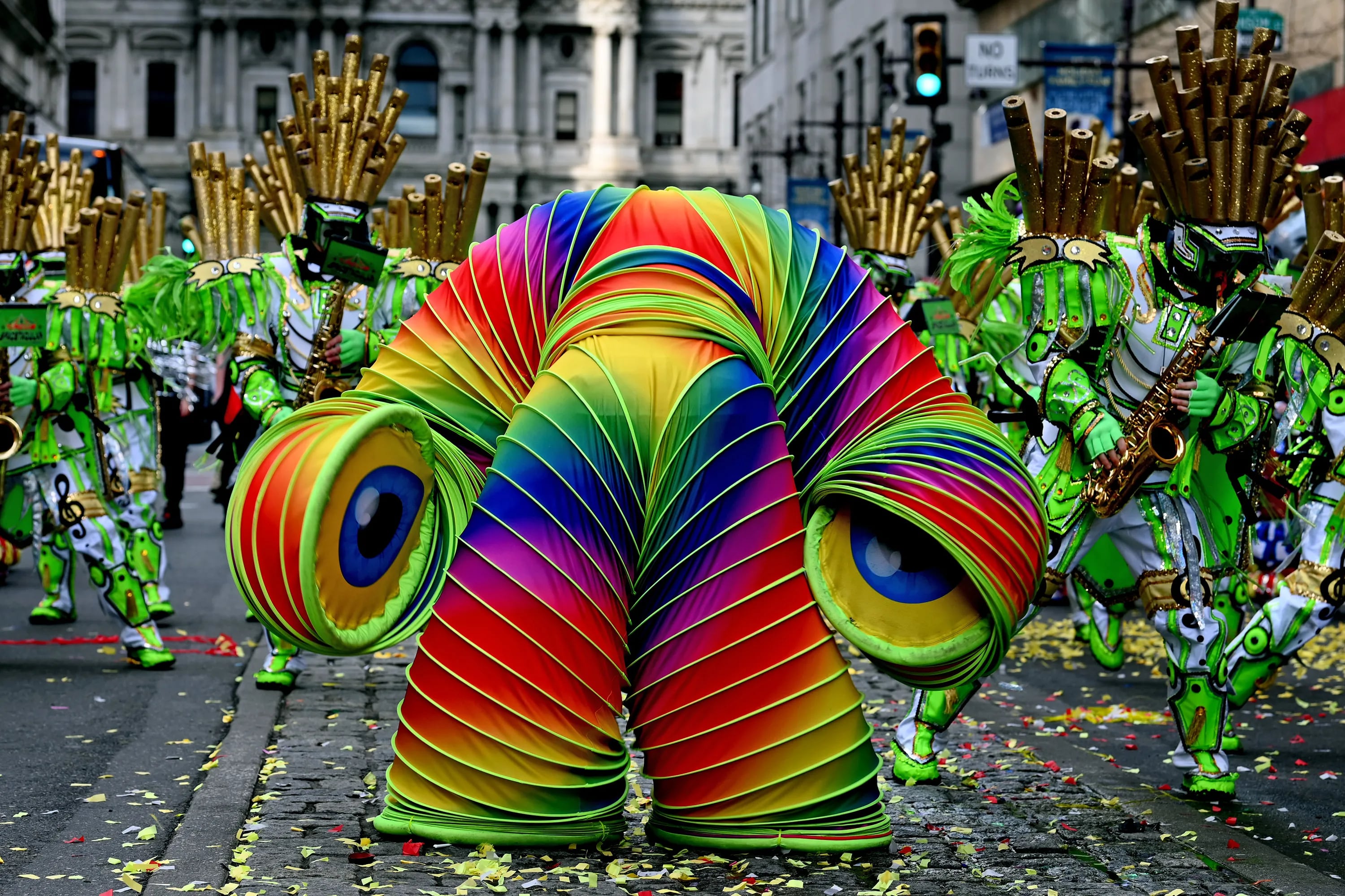 A headless “Slinky” space alien marches with first place-winning South Philadelphia String Band, during its “Circus Space-Tacular” performance on South Broad Street during the Mummers Parade Jan. 2, 2022. 