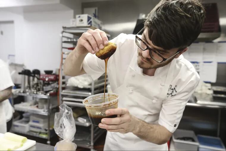 Talk restaurant at 2121 Walnut street, chef and co-owner Tim Lanza making a Savory Eclair with chicken liver sour cherry.