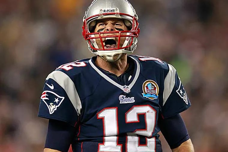 New England Patriots quarterback Tom Brady (12) reacts after running yardage during the third quarter of an NFL football game against the Houston Texans in Foxborough, Mass., Monday, Dec. 10, 2012. (Steven Senne/AP)