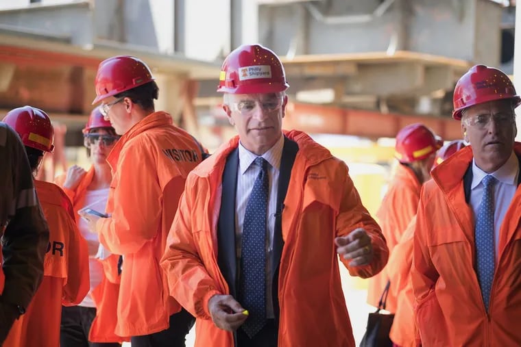 Philly Fed chief Patrick Harker (center) discussed apprenticeships Thursday in Austin, Texas. In June, he visited with apprentices at the Philly shipyard.