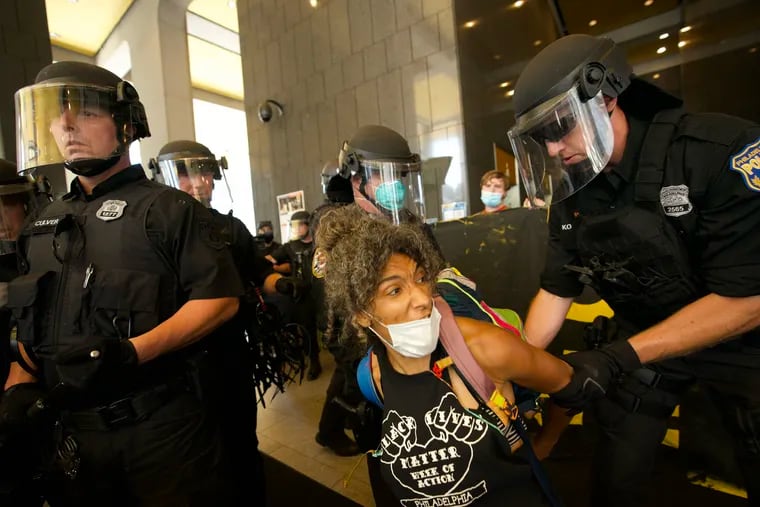 A protester is arrested at the MSB building during a demonstration in its lobby in Philadelphia, Pa. on June 23, 2020.