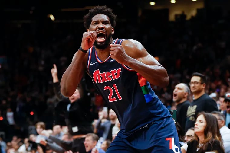Sixers center Joel Embiid celebrates after making the game-winning overtime three-point basket.