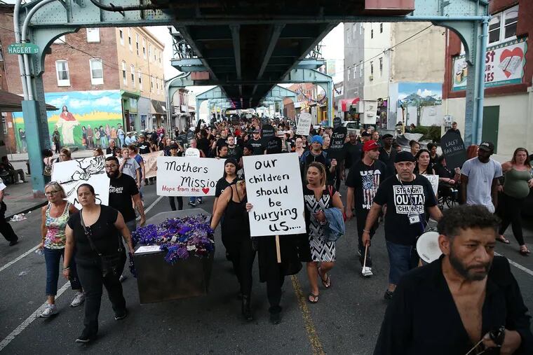 Marchers make their way up Kensington Avenue during the "March in Black" on International Overdose Awareness Day last year.