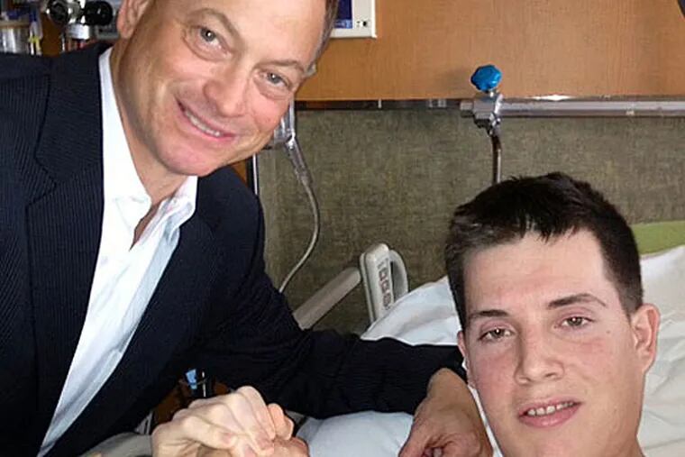 Actor Gary Sinise with Lance Cpl. Mark Fidler, an amputee, whose mother, Stacy, of Strausstown, Berks County, has been an advocate and companion for her son at Walter Reed.