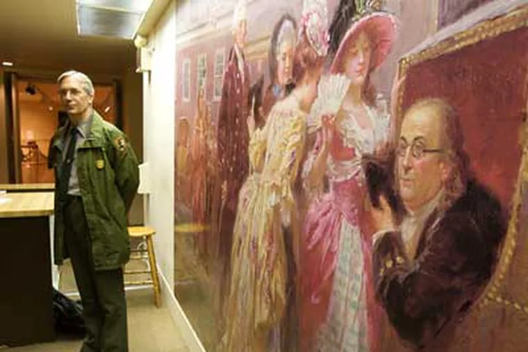 Stephen M. Sitarski, the Chief of Interpretation & Visitor Services  at Independence National Historic Park, stands inside the Franklin Court Museum near the 1919 painting "Dr. Franklin's Sedan Chair."  (John Costello / Staff Photographer)