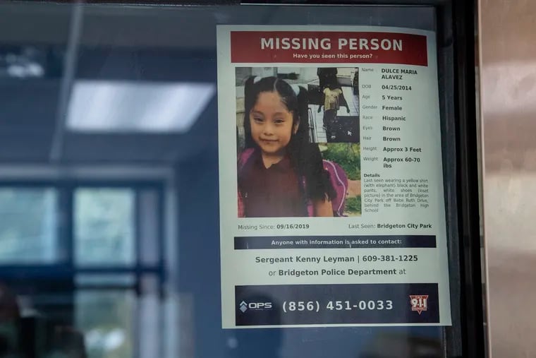 A missing poster of 5-year old Dulce Maria Alavez is shown posted on the window of the Bridgeton Police department.