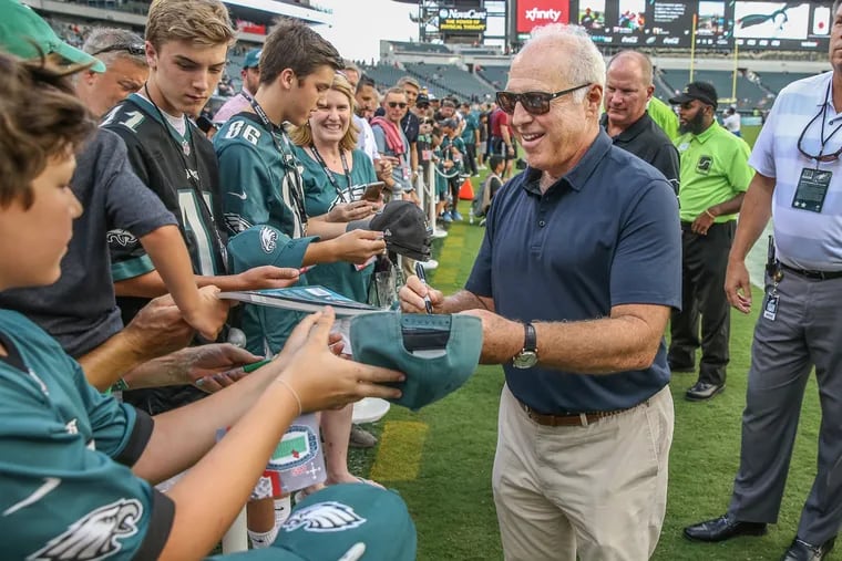 Philadelphia Eagles owner Jeffrey Lurie, right, signs autographs and chats up Ealges fans before the preseason game agaisnt the New York Jets on Thursday, August 30, 2018.