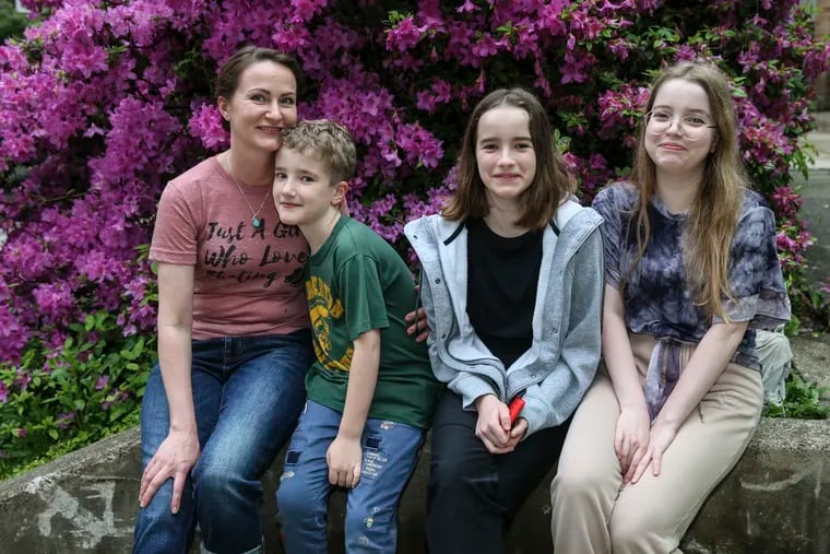 Veronika Pavliutina, a single mom, poses with her children (l-r) Yegor (8), Nina (11) and Polina (14), newly landed with a host family in Mount Airy after fleeing the war in Ukriane. The photo was taken Friday,  May 13, 2022.