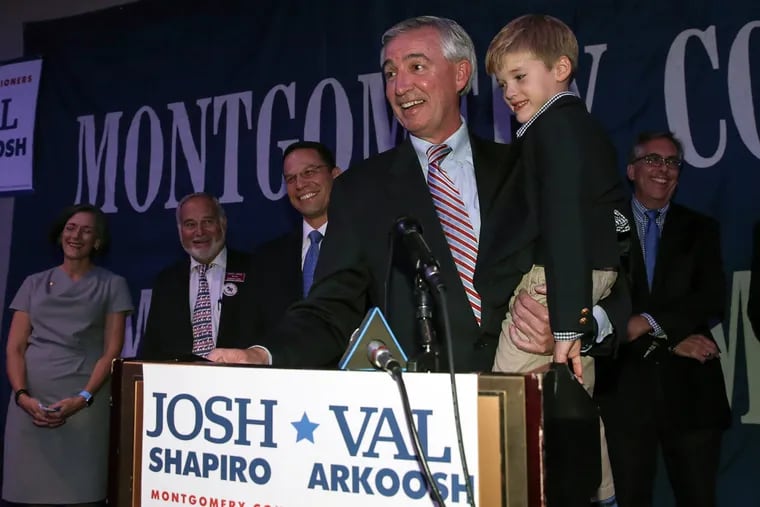 Montgomery County District Attorney-elect Kevin Steele, with his 5-year-old son Grayson, celebrates his win with supporters in King of Prussia on Nov. 3, 2015.