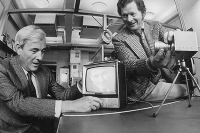 Penn grad George Smith (right) and Willard Boyle at Bell Labs in 1970 working with the device that helped them win a share of the 2009 Nobel Prize for Physics. They are demonstrating an experimental TV camera that contained their charge coupled-device instead of the vacuum tube of a conventional TV camera.