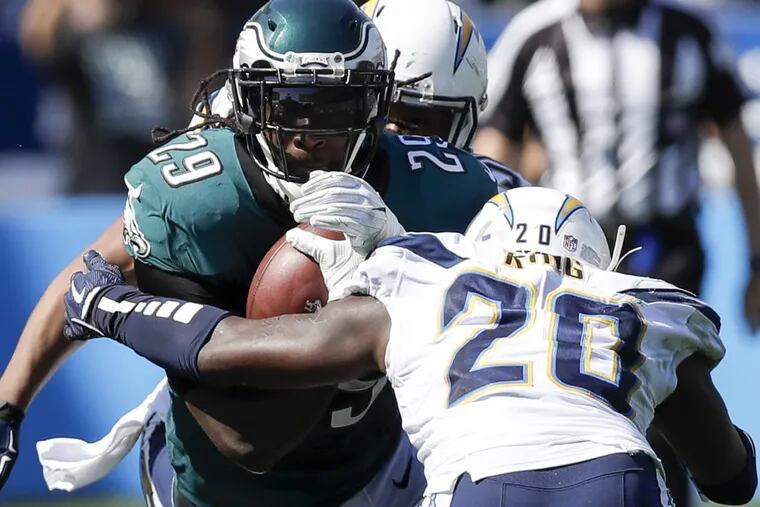 Eagles running back LeGarrette Blount tries to get past Chargers defensive back Desmond King in Sunday’s game.