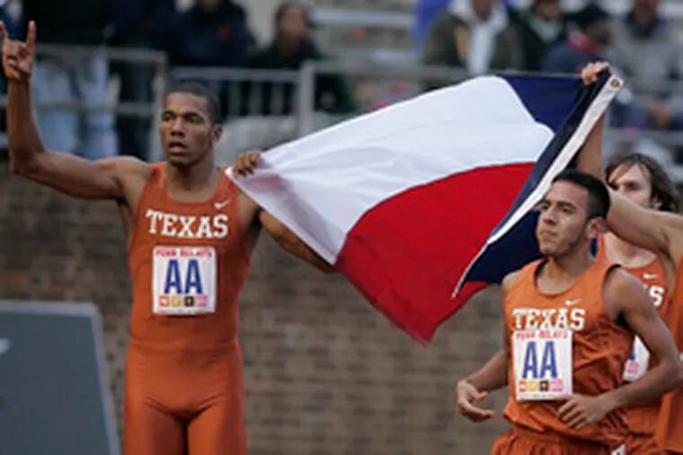 The University of Texas distance medley team runs its victory lap. Taking part were (from left) Joseph Davis, Leonel Manzano, Erik Spencer (partially hidden) and Jacob Hernandez.