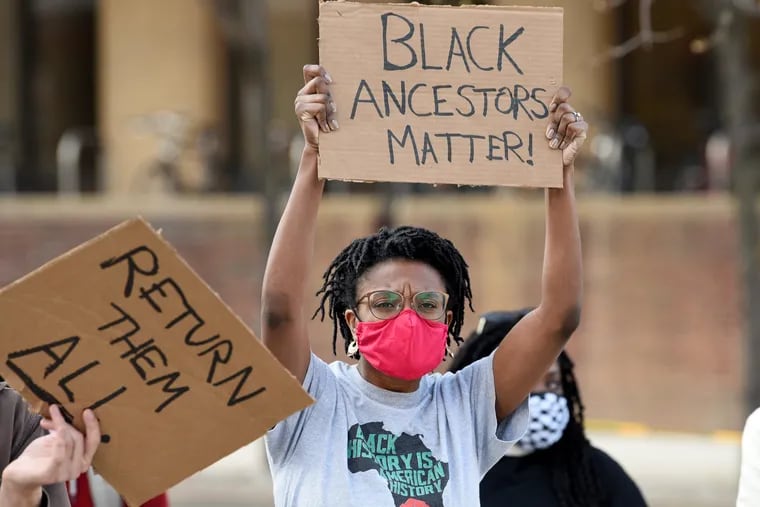VanJessica Gladney, a Penn grad student with the Penn & Slavery Project attends a rally April 8 organized by Police Free Penn demanding that the Penn Museum repatriate skulls held by the Morton skull collection.