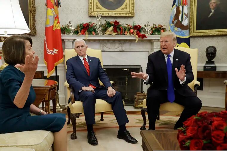 President Trump and Vice President Pence meet with House Minority Leader Nancy Pelosi, at left, and Senate Minority Leader Chuck Schumer, not shown, in the Oval Office on Tuesday.