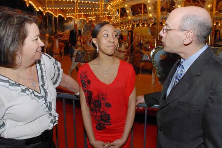 Former State Sen. Connie Williams (left), board chairman of Steppingstone, talks with Steppingstone Scholar Renee Johnson of Germantown Friends School, and board member Gary Deutsch. The event raised $290,000 for Steppingstone.