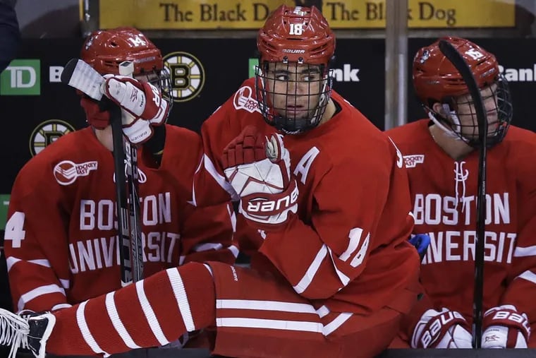 Boston University forward Jordan Greenway, sitting on the boards as he awaits a line change during a Feb. 5 game.