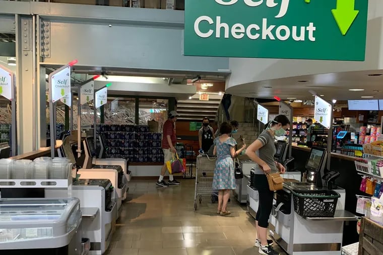 Like many supermarkets, Whole Foods is replacing its cashiers with self-checkout stations. This photo was taken in suburban Washington, D.C.
