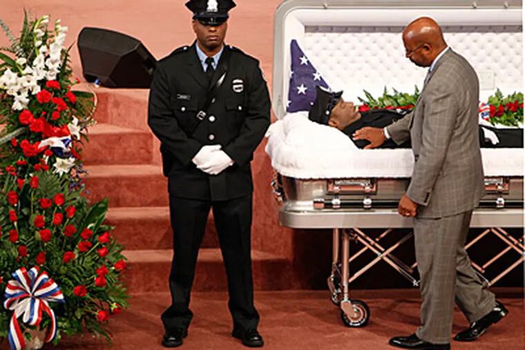 Mayor Michael Nutter says goodbye to fallen Philadelphia police officer Moses Walker Jr. during a viewing at Deliverance Evangelistic Church on August 26, 2012. (DAVID MAIALETTI  /  Staff Photographer)
