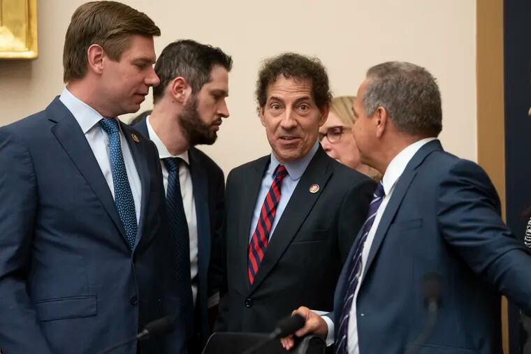 House Judiciary Committee members Rep. Eric Swalwell (far left), Rep. Jamie Raskin (center), and Rep. David Cicilline (far right) talk before a hearing on Capitol Hill in Washington on Monday.
