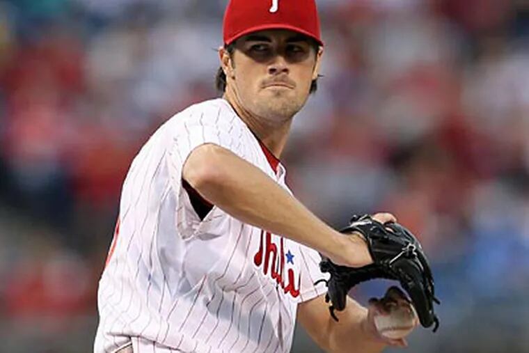 Cole Hamels pitched eight scoreless innings against the Giants, giving up two hits and striking out nine batters. (Yong Kim / Staff Photographer)