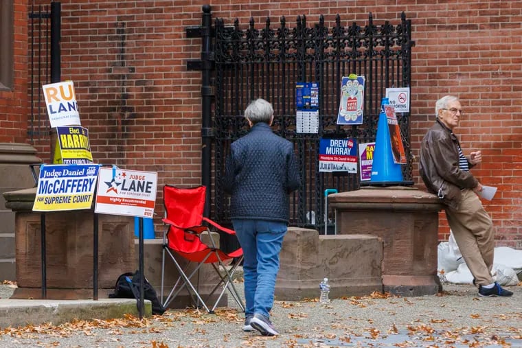 Election workers stand outside the Tenth Presbyterian Church at 17th and Spruce Streets in Philadelphia on Election Day last week.